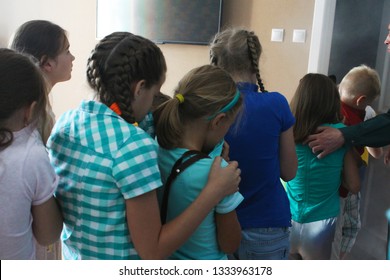 VITEBSK, BELARUS - JULY 13, 2018. Kids Are In The Centre For Safety. Interactive Learning About Fire Safety And Evacuation Training. Kids Covering Their Noses And Mouths To Prevent Inhaling Fire Smoke