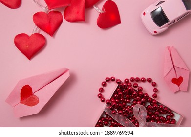 Vitebsk, Belarus-January 9, 2021:pink Car Toy, Red Beads ,pink Plane And Hearts On Pink Background.valentine's Day.happy New Year.mother's Day.women's Day.