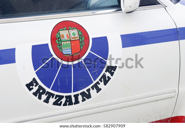 VITORIA, SPAIN - FEBRUARY 19,\
2017: Ertzaintza logo in one of their cars. Ertzaintza is the\
police force for the autonomous community of Basque Country,\
Spain.