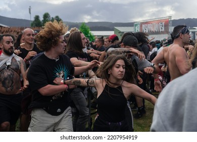 Viveiro, Galicia; 06-29-2022: Pogo - Mosh Pit - In A Rock Metal Concert. Resurrection Fest. Angry People Running Live Music Open Air