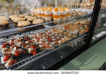 Vivid array of confections showcased enticingly on glass shelves