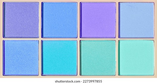 Vivid colored eye shadow makeup palette as banner violet  blue  teal colors  Female cosmetic   beauty product  trendy color eyeshadow in square package  aesthetic texture background  top view