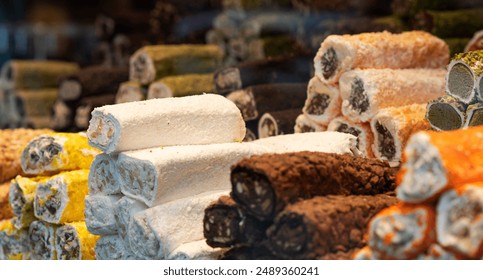 a vivid display of Turkish delight, piled in vibrant colors and dusted with powder, showcasing an array of flavors and textures, invitingly arranged in a traditional sweet shop. - Powered by Shutterstock