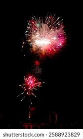 vivid fireworks explode over the beach