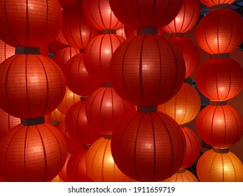 Vivid Illuminated Closed-up Chinese Lanterns Pattern Background. Chinese New Year Celebration Background. Oriental Pattern Background.