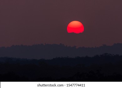 A Vivid Orange Sun Due To Bushfire Smoke In The Blue Mountains, New South Wales, Australia.