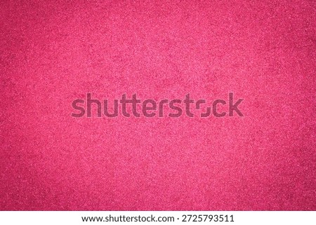 Vivid red glitter texture background with shimmering metallic sparks. Luxury glowing sequin surface for festive Christmas celebration, Valentine's Day, wedding backdrop, or creative glamour design.