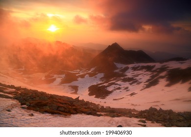 Vivid Sky And Clouds Above Snowy Mountains At Sunset 