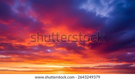 Vivid Sunset Sky with Dramatic Clouds in Fiery Orange and Purple Tones