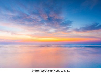 Vivid Twilight Sunset Sky And Motion Blur Of The Sea Under With Long Exposure Effect.