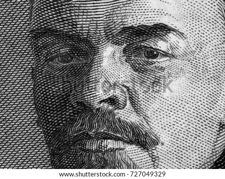 Vladimir Lenin portrait on old Russia ruble banknote macro, leader of Russian Revolution 1917, black and white.