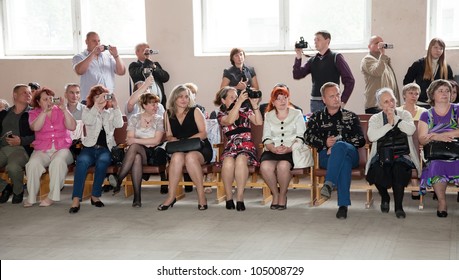 VLADIMIR, RUSSIA - MAY 24: 'Last Bell' Event. May 24, 2012 In Vladimir, Russia. School Leavers Celebrate The 'Day Of Farewell Bell'  In School Ã?Â¹ 33. Parents And Friends Looking The Ceremony