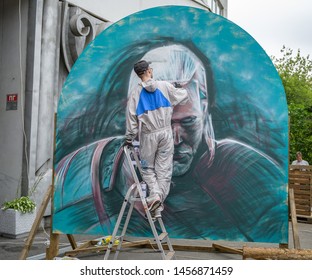 VLADIVOSTOK, RUSSIA - JULY 20, 2019: Festival On The Game And A Series Of Books Series Witcher. A Man Paints A Portrait Of Geralt Of Rivia.