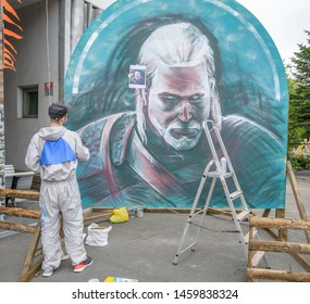 VLADIVOSTOK, RUSSIA - JULY 20, 2019: Festival On The Game And A Series Of Books Series Witcher. A Man Paints A Portrait Of Geralt Of Rivia.