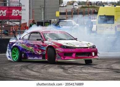 VLADIVOSTOK, RUSSIA - OCTOBER 02: Car drift, Sports car wheel drifts and a lot of smoke on the track. Russian drift show RDS without borders on October 02, 2021.