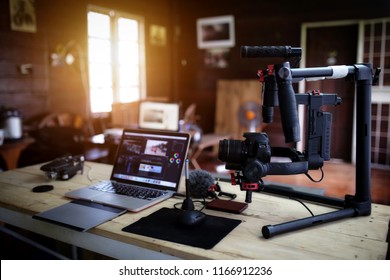 Vlogger equipment for Filming a movie or a video blog Drone Steadicam Camera Stabilizer and laptop. - Shutterstock ID 1166912236