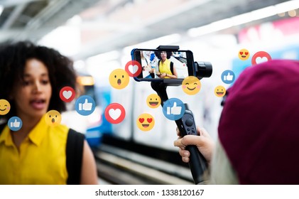 Vlogger Streaming A Live Video Live At A Train Platform