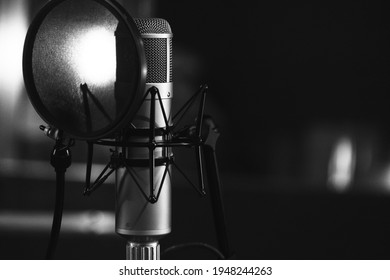 Vocal Microphone On A Stand In The Recording Studio. High Contrast. Close Up. Copy Space