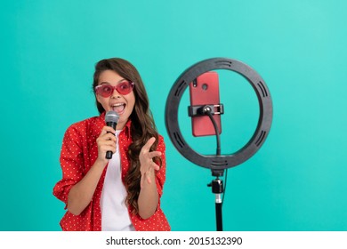 vocal tutorial lesson online. happy teenage girl singer use selfie led. kid music blogger.