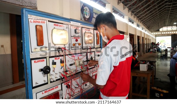 
Vocational high school students practice car
electricity. Photo taken in Central Java Indonesia on February 3,
2022 		