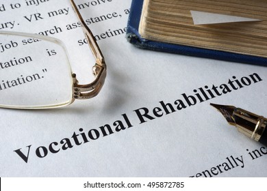 Vocational Rehabilitation Written On A Paper And A Book.