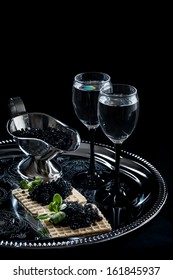 Vodka And Black Caviar On Black Background