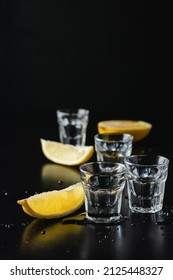 Vodka With Lemon In Shot Glasses. Strong Alcoholic Drink.