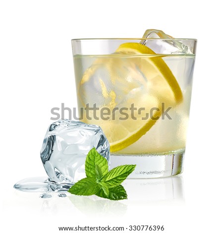 Vodka lime, gimlet or gin tonic with ice in glass on white background 