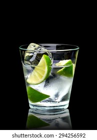 Vodka Lime Or Gin Tonic With Ice In Rocks Glass On Black Background Including Clipping Path