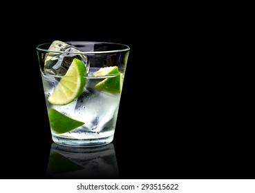 Vodka Lime Mojito Or Gin Tonic  With Ice In Rocks Glass On Black Background Including Clipping Path