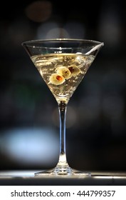 Vodka Martini On A Bar With Three Olives