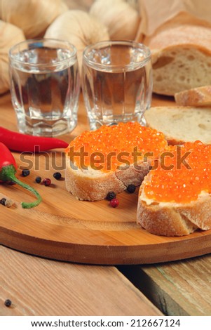 vodka and sandwich with red caviar