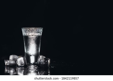 Vodka. Shots, glasses with vodka with ice .Dark background. Copy space .Selective focus - Shutterstock ID 1842119857