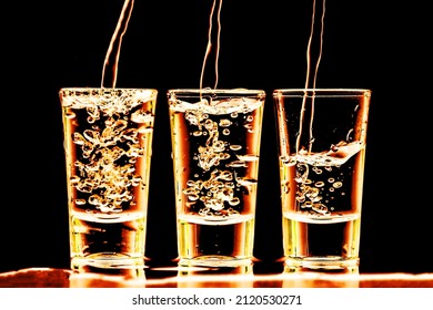 Vodka shots in a row. Neon bar encounter. Illuminated transparent glass. Pouring liquor. Weekend party alcohol background. Golden color vodka party.