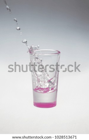 Vodka splash in glass