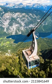 Vogel, Slovenia - 29 August 2014: Cable car cabin following a rope to the top of Vogel mountain in Slovenia. In the valley is Lake Bohinj.