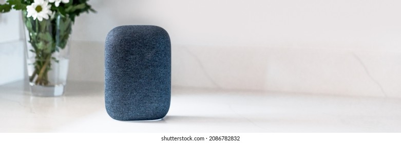 Voice Controlled Smart Speaker, Blurred Kitchen Background