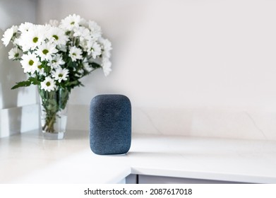 Voice Controlled Smart Speaker, Blurred Kitchen Background