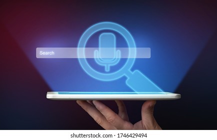 Voice Search. Male Hand Holding Digital Tablet Computer Using Vocal Recognition App Over Blue Studio Background. - Powered by Shutterstock