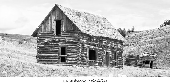 Voices From The Past / 1800's cabin with a hayloft later added above in the high plains of south park colorado in pike national forest, shot in monochrome high key.