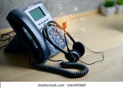 VOIP Services Concept Of IP Telephone Device And Headset With Flying Icon Of Voip Services