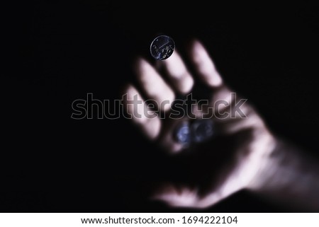 Similar – Close-up of a man’s hand holding a dried leaf of quercus