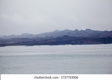 Volcanic Craters On The Island San Cristóbal, Galapagos, Confused With The Marine Haze