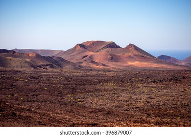Volcanic landscape in Tmanfaya national park on Lanzarote island in Spain - Shutterstock ID 396879007