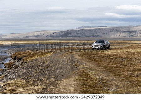 Volcanic landscape of the Thórsmörk (Þórsmörk) valley in South Iceland with an off-road 4x4 car on Markarfljót river crossing (F249 road). Stock photo © 