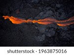 Volcanic lava flowing on rough hot ground