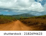 A volcanic red dirt road on the Hawaiian island of Lanai, the Kanepuu Highway, runs between Lanai City and Garden of the Gods 