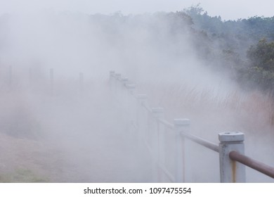 Volcanic Steam Rising And Obscuring A Rusty Guard Rail, Mount Kilauea, Volcanoes National Park, Big Island, Hawaii