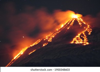 Volcano Etna erupting at night. Mount with lava and magma