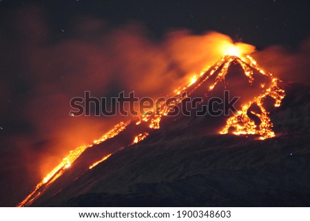 Volcano Etna erupting at night. Mount with lava and magma